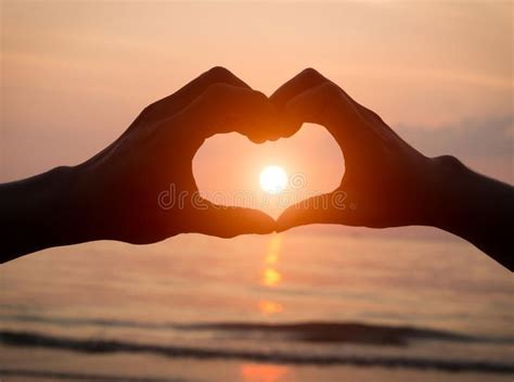 Couple Holding Hands Heart Love at Sunset on Beach