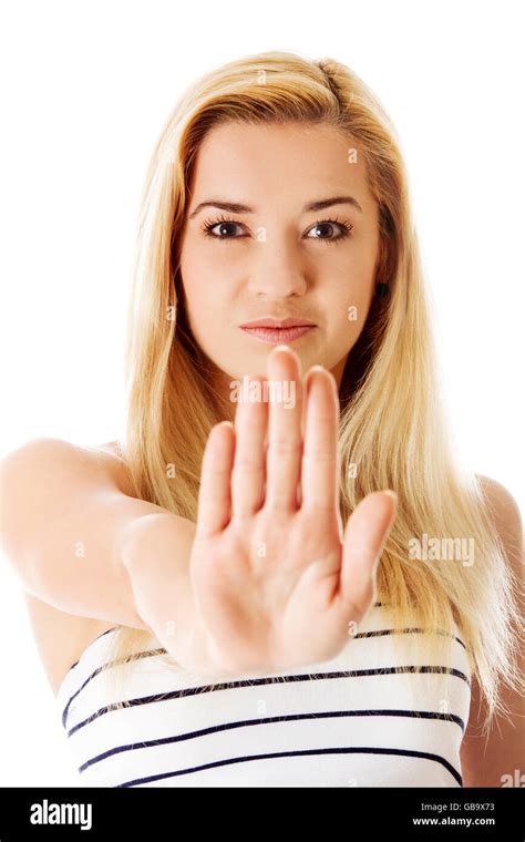 Young woman making stop sign on white background Stock Photo - Alamy