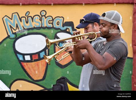 Cuban musicians playing salsa music for locals and tourists at the Casa de la Músíca in Trinidad ...