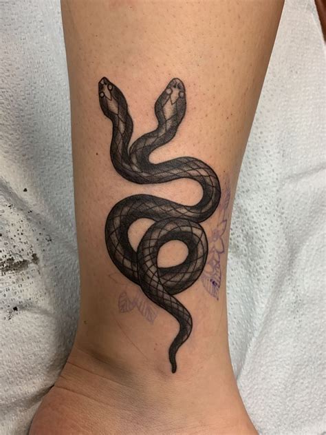 Two headed snake tattoo | Butterfly tattoo designs, Tattoo designs, Butterfly tattoo