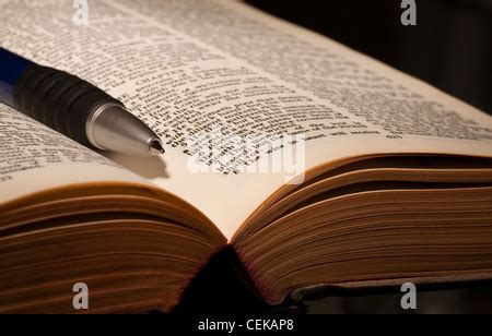 Open bible with pen Stock Photo - Alamy