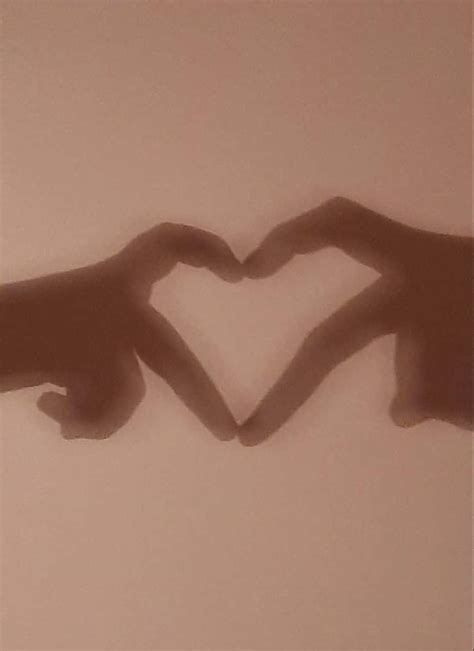 Download Couple Hands Heart PFP Wallpaper | Wallpapers.com