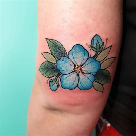 2/2 of Emma's little matching blue blossoms. @withlovetattoo #tattoo #tattoos #ink #flower # ...