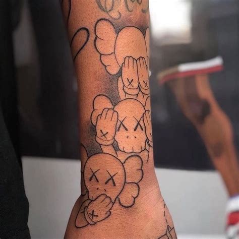 KAWS Tattoo !! in 2023 | Hand tattoos for guys, Arm tattoos for guys ...