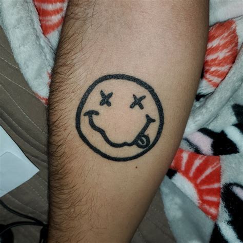 Nirvana Smiley Face Logo Tattoo