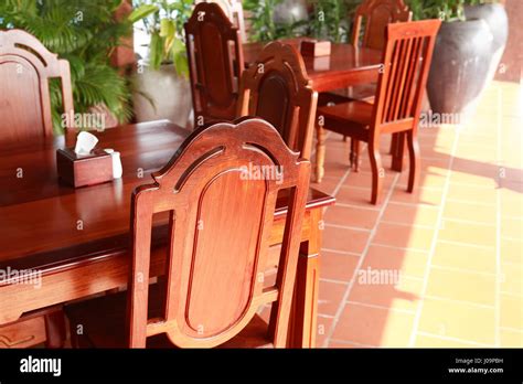Interior of nice empty modern dining room with wooden furniture Stock Photo - Alamy