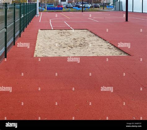 Sand pit for the long jump competition at the school athletics stadium ...