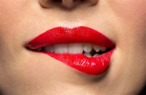 What does it mean when a girl bites her lip? | Body Language Central