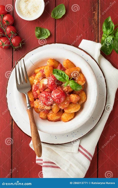 Potato Gnocchi. Traditional Homemade Potato Gnocchi with Tomato Sauce, Basil and Parmesan Cheese ...