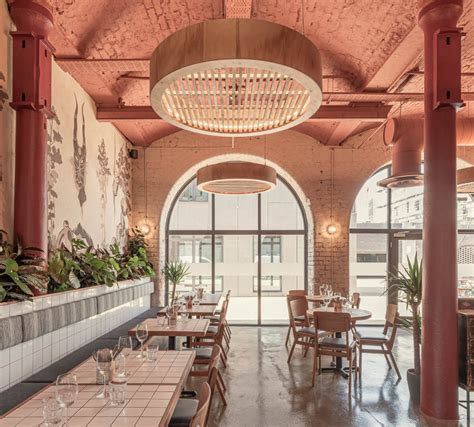 the inside of a restaurant with tables and chairs