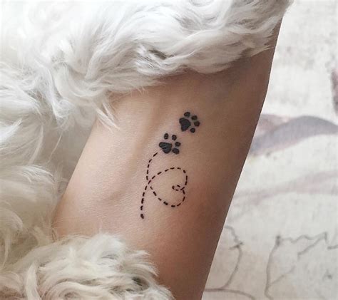 The 80+ Cutest Paw Print Tattoos Ever | The Paws | Wrist tattoos girls, Pawprint tattoo, Dog paw ...