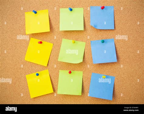 Colour note papers on pin board. Cork background Stock Photo - Alamy
