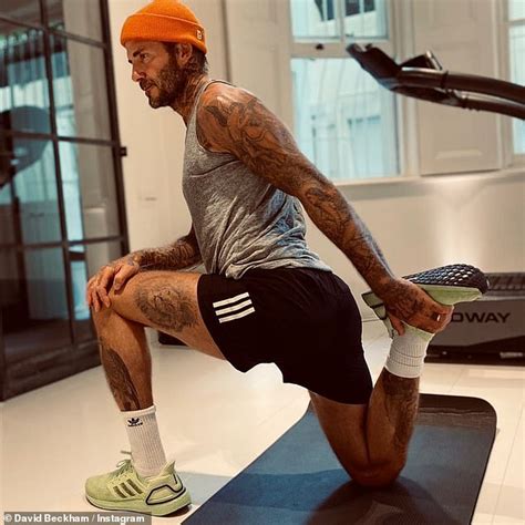 David Beckham sends fans wild as he stretches in shorts following his ...