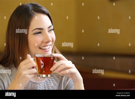 Hands holding tea cup hi-res stock photography and images - Alamy