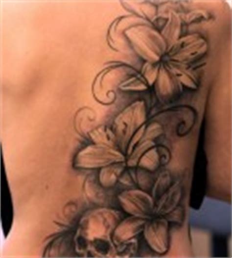 Black flowers back tattoo - | TattooMagz › Tattoo Designs / Ink Works / Body Arts Gallery