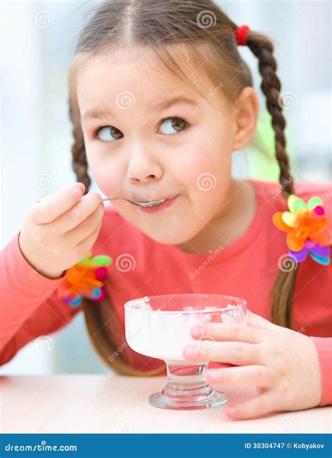 Little Girl is Eating Ice-cream in Parlor Stock Image - Image of little, brunette: 30304747