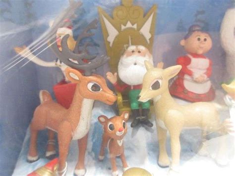 2010 Rudolph figurine collection, includes: 21-Figurines and display base, front plastic ...