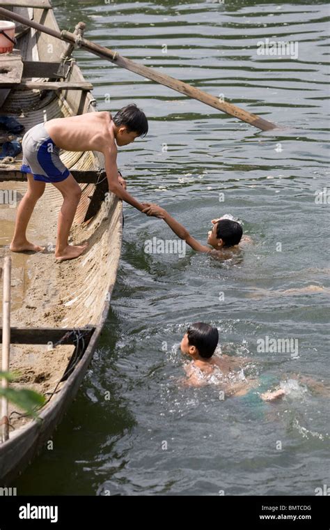 Mekong River,Vietnam;Young Boys Swimming Stock Photo: 30040124 - Alamy