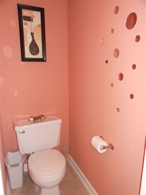 Half bath on the first floor. Repainted, stick-on mirror circles. Coral Island from Sherwin Wil ...
