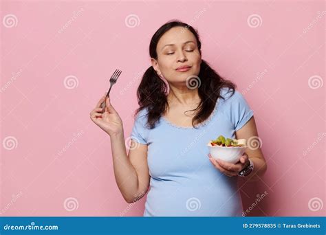 Delightful Expectant Pregnant Woman Eating Fruits Salad, Isolated Pink Background. Healthy ...