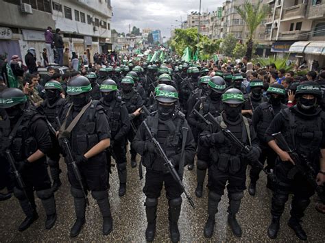 Israel-Palestine conflict: Hamas anniversary parade sees militants display rockets and heavy ...