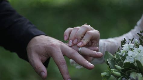 Bride Wear Ring on Groom`s Finger. the Groom Puts the Wedding Ring To Finger of the Bride Stock ...