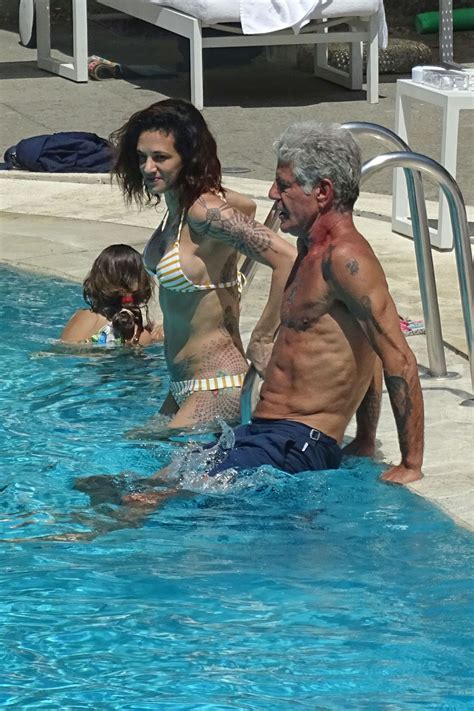 ASIA ARGENTO in Bikini and Anthony Bourdain at a Pool in Rome 09/20/2017 – HawtCelebs