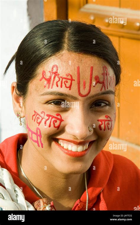 Devotee writing radhe krishna on face by sandalwood paste, uttar pradesh, india, asia Stock ...