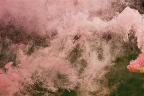 Premium Photo | Pink smoke from a smoke bomb in nature