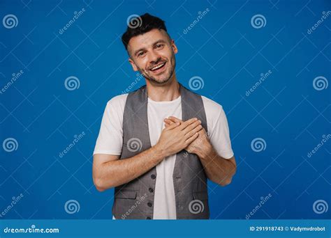 Smiling Man Holding Hands on Chest Isolated Over Blue Wall Stock Image ...