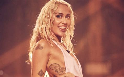 Miley Cyrus Celebrates ‘Flowers’ in Fiery Ombré Bikini for Dolce Glow ...