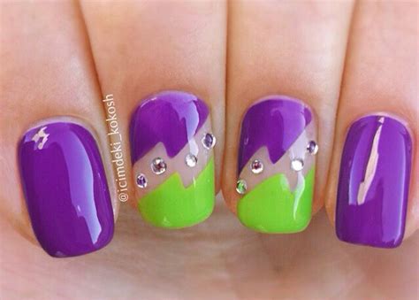 purple and green nail polish with silver accents