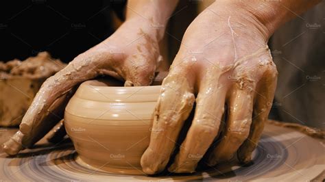 Potter is making clay pot on the potter's wheel stock photo containing ...