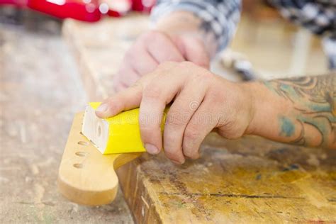 Carpenter Sanding a Guitar Neck in Wood at Workshop Stock Photo - Image of electric, faber: 66957226