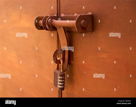 old lock on bronze metal garage door Stock Photo - Alamy