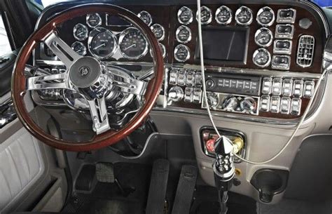 the interior of an old car with wood trim and gauges, steering wheel ...