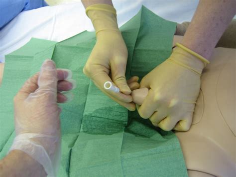 File:Urinary catheterization with a doll.jpg - Wikimedia Commons