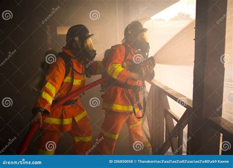 Firefighter in action editorial stock photo. Image of courageously ...