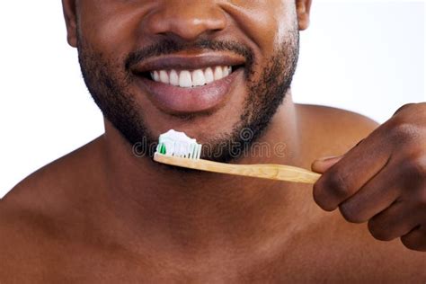 Pearly Whites. Studio Shot of an Unrecognizable Young Man Brushing His ...