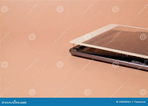 A Broken Tablet With A Swollen Battery And A Dirty Screen Stock Image ...