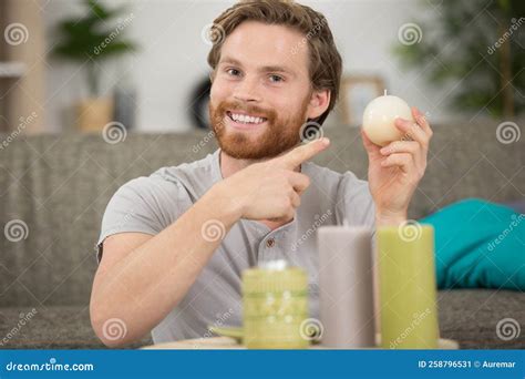 Happy Man Holding Chirstmas and Candle Decorations Stock Image - Image ...