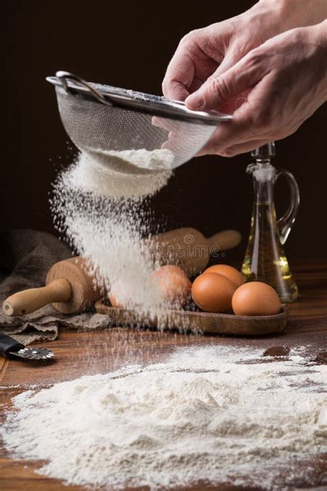 Sifting Flour from a Strainer on a Wooden Table Stock Image - Image of homemade, hands: 112515703