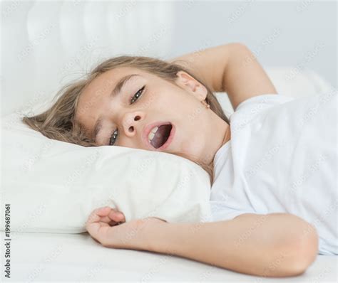 close up little girl sleeping with her mouth open, snoring Stock Photo | Adobe Stock