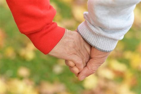 Premium Photo | Elderly couple holding hands