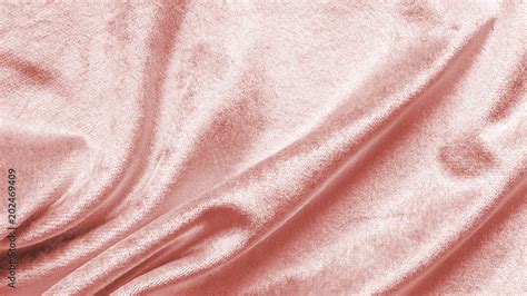 Rose gold pink velvet background or velour flannel texture made of cotton or wool with soft ...