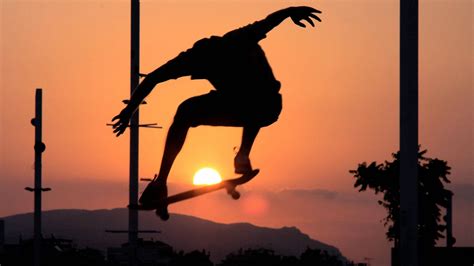 Download Aesthetic Skater Boy With Sunset Wallpaper | Wallpapers.com
