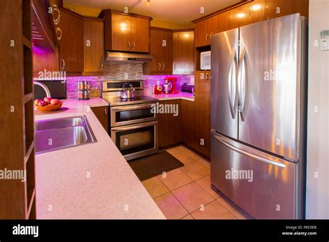 Modern Dining room with kitchen on the background Stock Photo - Alamy