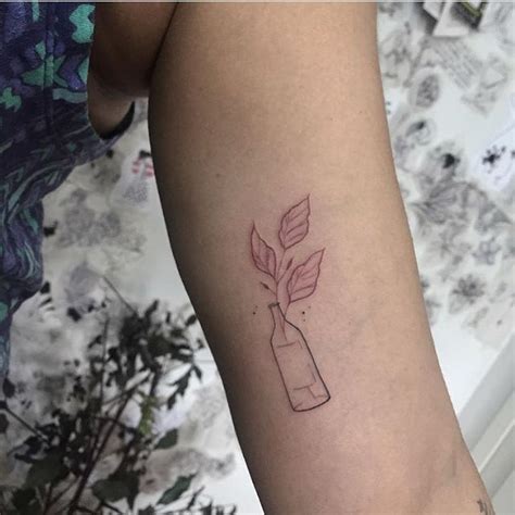 Bottle with leaves - Tattoogrid.net