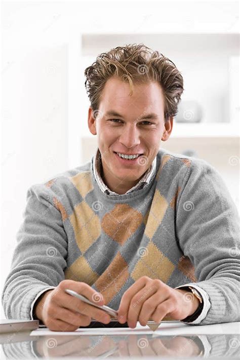 Young man writing at desk stock image. Image of caucasian - 8377695