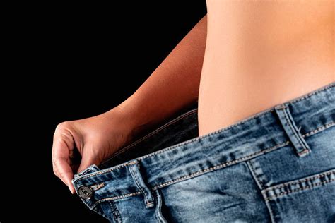 A woman with a fat belly in jeans, the concept of losing weight - Creative Commons Bilder